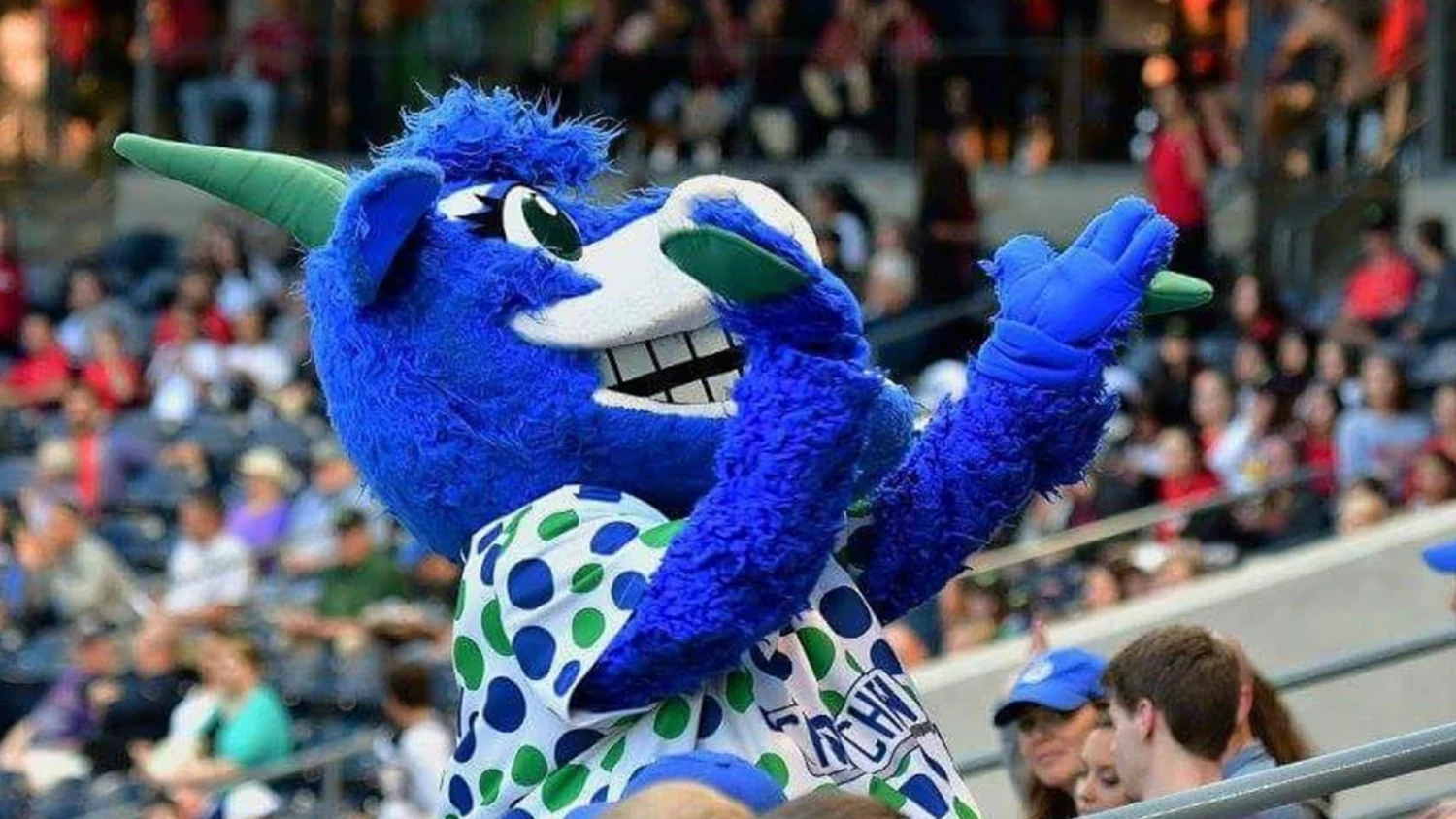 Hartford Yard Goats mascot Chew Chew cheering with fans at the ballpark