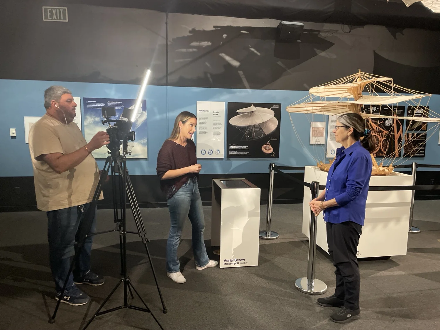 Media crew filming inside the Leonardo da Vinci exhibition