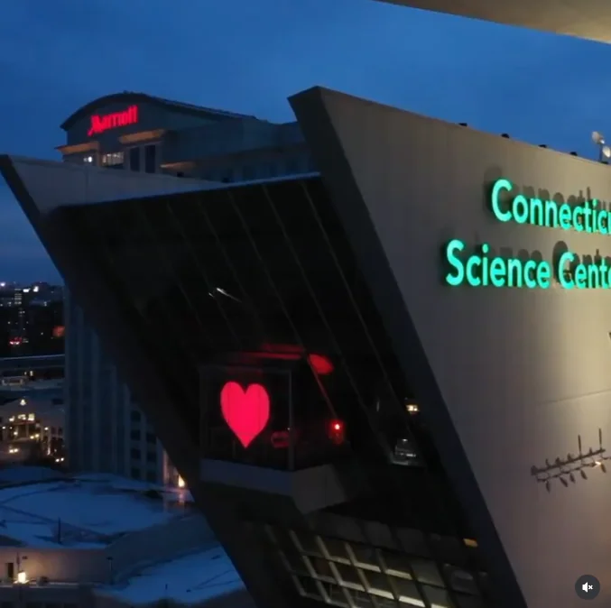 Connecticut Science Center illuminated at dusk